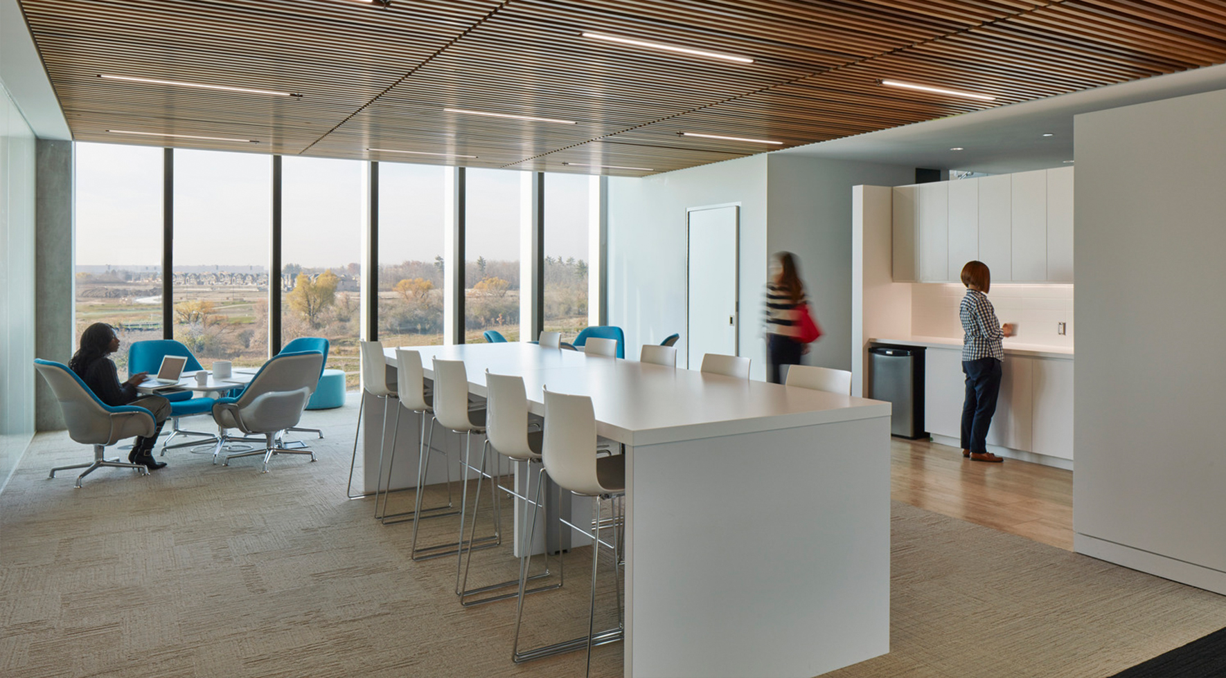 Warm contemporary corporate employee work café at Canon offices